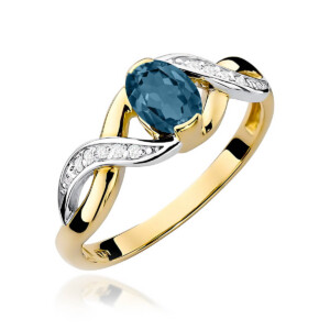 Kihlasõrmus. Gold ring with a blue oval gemstone and pavé diamonds on the split shank edge.