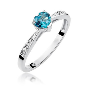 Kihlasõrmus. Silver ring with a teal blue oval-cut gemstone held by four prongs and pavé diamonds along the band.