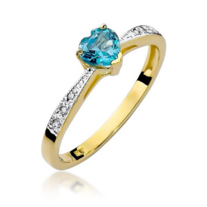 Kihlasõrmus. Gold ring with a blue heart-cut gemstone held by four prongs and pavé diamond accents along the band