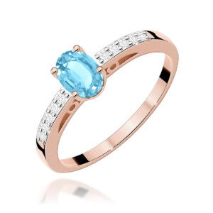 Kihlasõrmus. Rose gold ring with an oval blue topaz (or aquamarine) center stone held by four prongs, with small diamonds along the band edge.