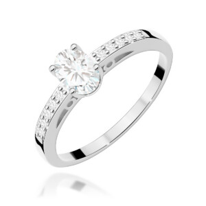 Kihlasõrmus.Engagement ring with a round center diamond and pavé-set diamonds along the band in white gold.