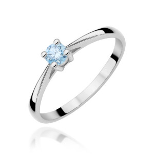 Silver ring with a round light-blue gemstone held by four prongs in a polished band surface point-of-view view