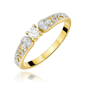 Gold ring with an ornate two-tone band and a central round diamond solitaire in a four-prong setting.