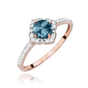 Kihlasõrmus. Rose gold ring featuring a round blue gemstone surrounded by a diamond halo on a pavé-diamond band.